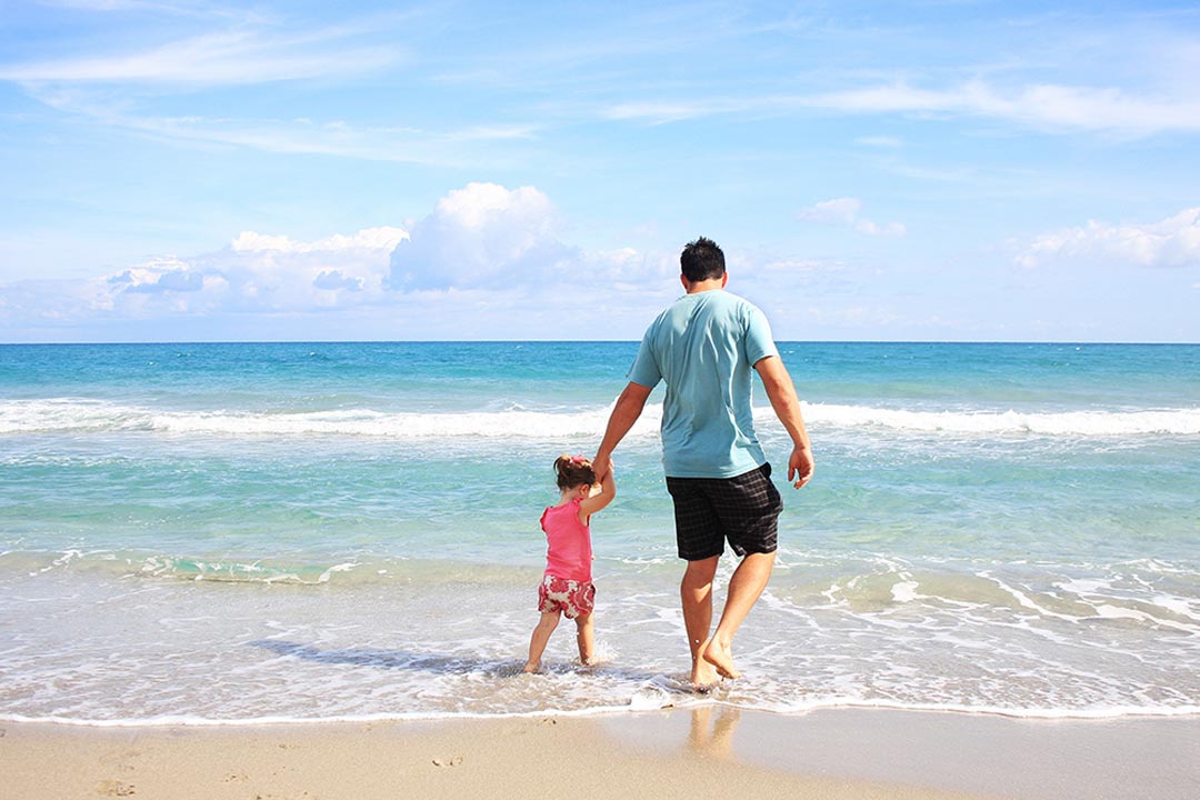 Family walking on the beach