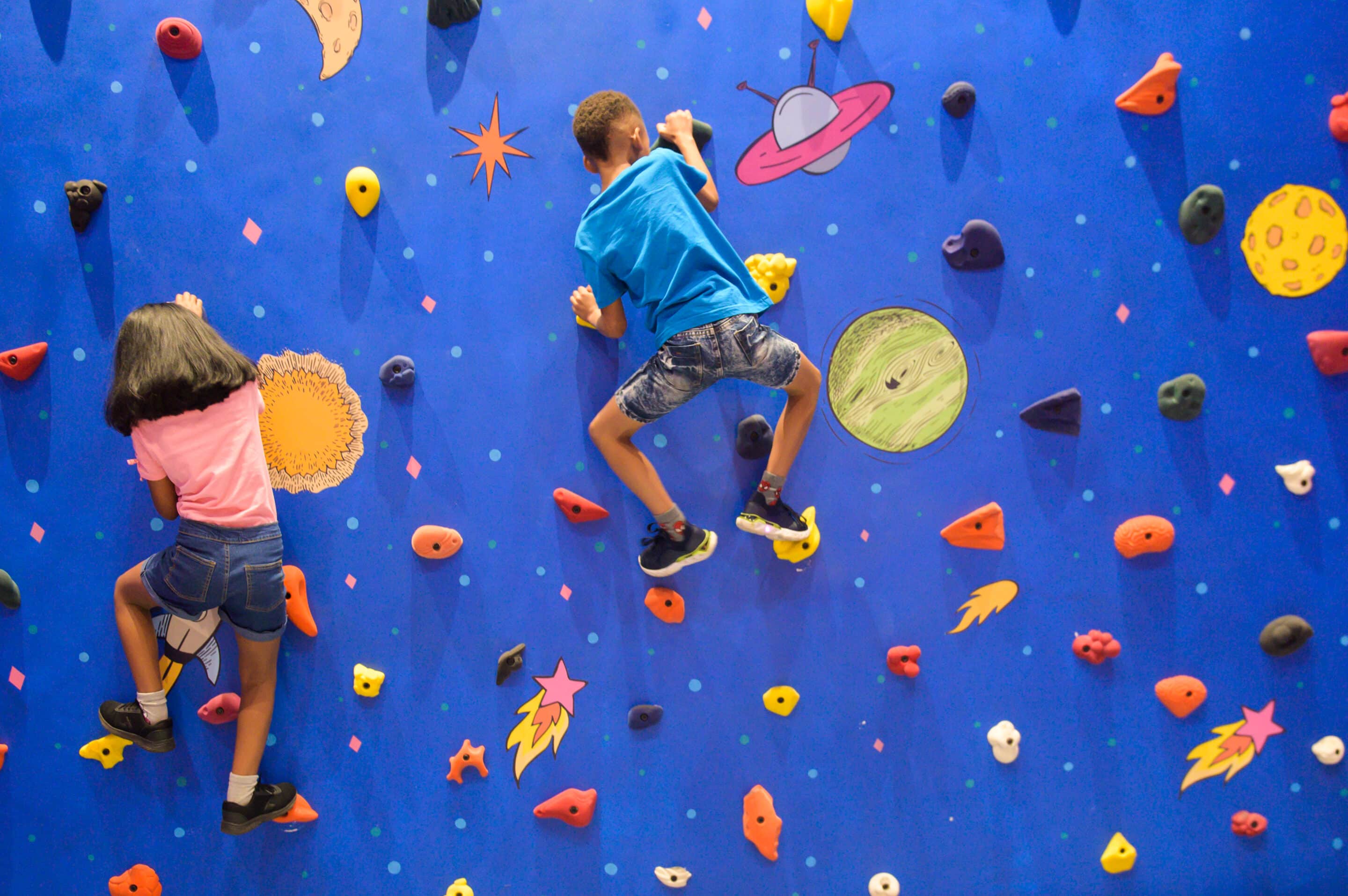 Kids Climbing a Climbing Wall at The Capital Zimbali 