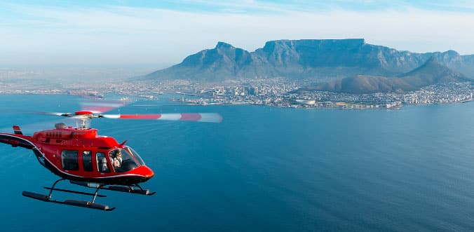 Helicopter flying near the coast of Cape Town