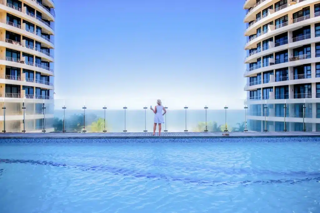 person standing near rooftop pool