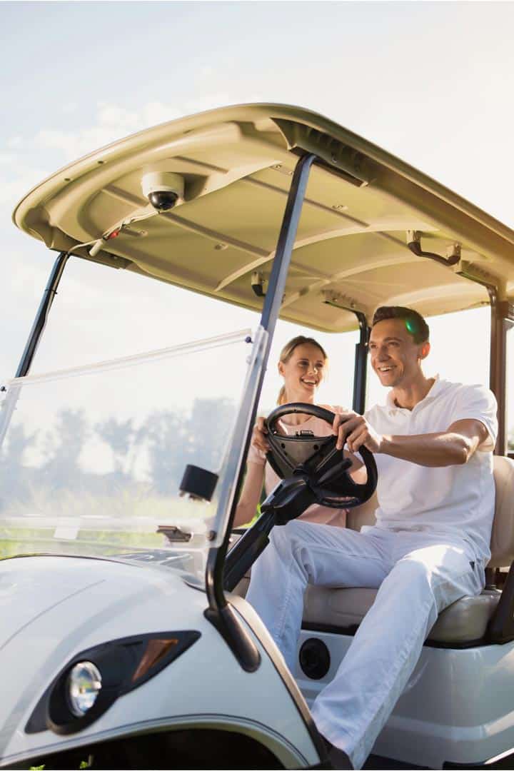 golf cart in zimbali and people playing golf