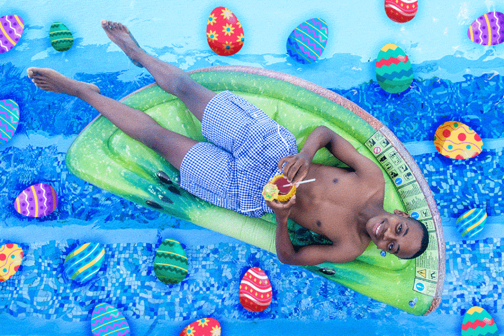 Man lying in a pool with easter eggs floating around him